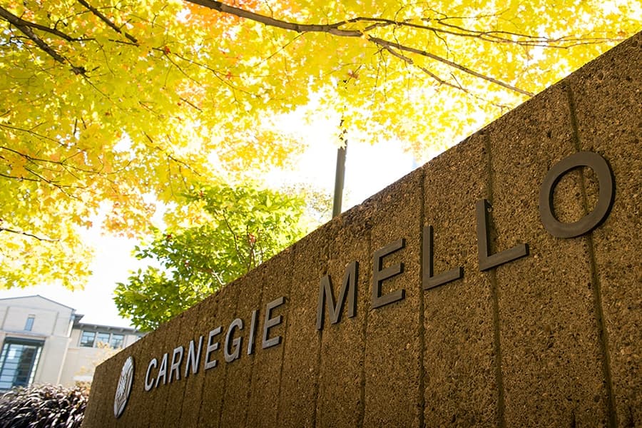 Carnegie Mellon University signage framed by autumn foliage